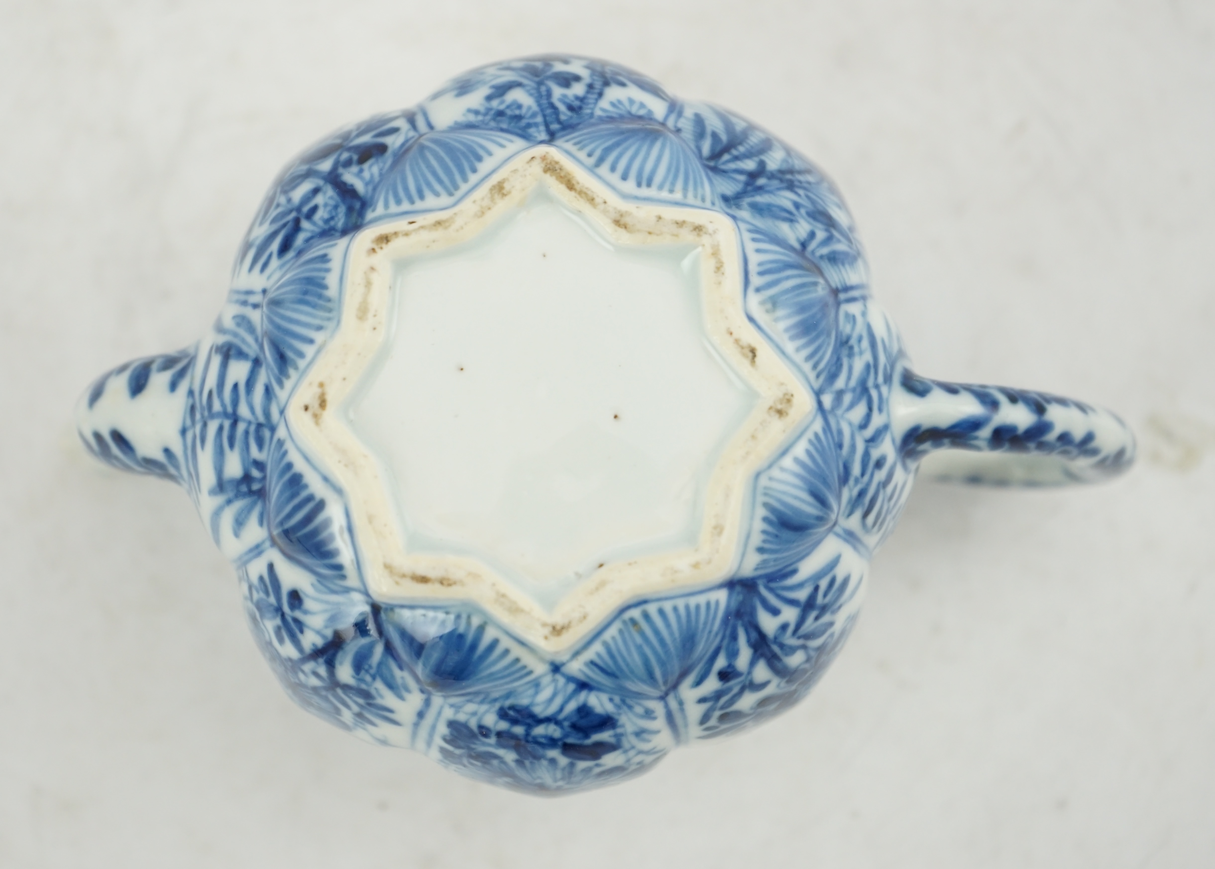 A Chinese blue and white lotus pod-shaped teapot and cover, Kangxi period